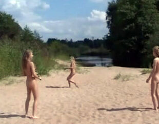 Scorching young ladies nudists frolicking at the nasty beach