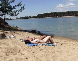 2 steamy russian teenage getting a suntan on the free beach.