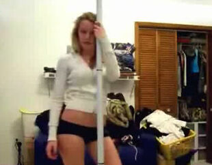 Cool bodacious teenage performing striptease at home