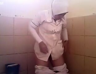 Arab female heads urinate in a public rest room