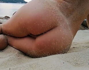 Stunning woman naturist at the beach